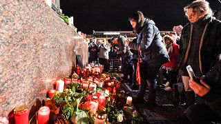 Mourners at a vigil for the victims of a shooting in Hanau