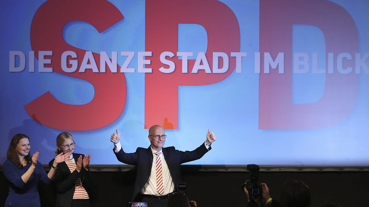 SPD top candidate and First Mayor of Hamburg Peter Tschentscher celebrates with supporters after exit polls for the Hamburg state elections announced on Feb. 23, 2020.