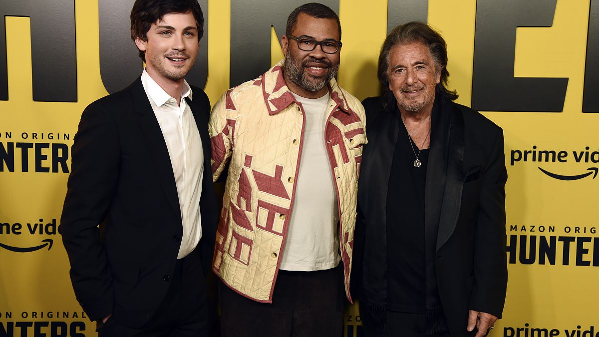 Jordan Peele, center, executive producer of the Amazon Prime Video series "Hunters," poses with cast members Logan Lerman, left, and Al Pacino at the premiere of the show.