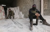 Turkish backed Syrian fighters prepare to go to a frontline near the village of Neirab, in Idlib province, Syria, Monday, Feb. 24, 2020. (AP Photo/Ghaith Alsayed)