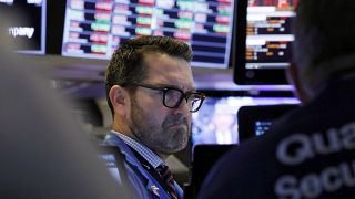 Trader Leon Montana works on the floor of the New York Stock Exchange, Friday, Feb. 28, 2020.