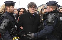 olice surround Catalonia's former regional president Carles Puigdemont as he arrives at the European Parliament in Strasbourg, eastern France, Monday, Jan. 13, 2020.