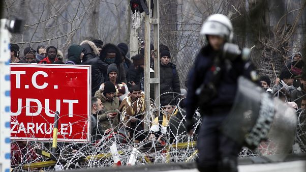Stand-off between 4,000 migrants and Greek border guards Stand-off between 4,000 migrants and Greek border guards