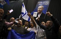 Supporters of Israeli Prime Minister Benjamin Netanyahu celebrate after first exit poll results for Israeli elections in Tel Aviv, Israel, Monday, March 2, 2020.