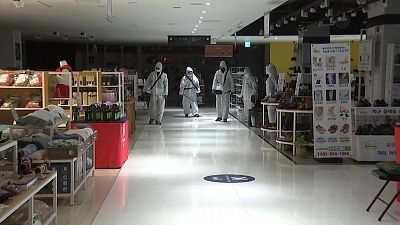 Workers disinfect South Korea department store as COVID-19 spreads