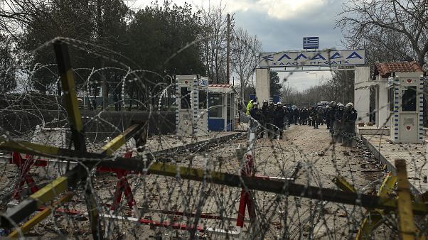 Greek Police guard Kastanies border gate, Evros region, as migrants gather between Greece and Pazarkule border gate (File Photo) Greek Police guard Kastanies border gate, Evros region, as migrants gather between Greece and Pazarkule border gate (File Photo)
