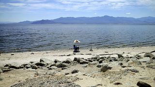 A man fishes along the receding banks of the Salton Sea near Bombay Beach, California, USA; in April 30; 2015.