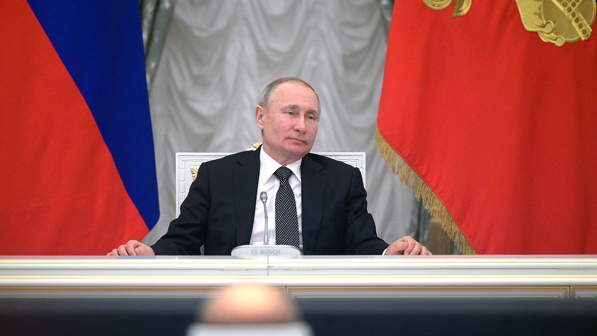 Russian President Vladimir Putin attends a meeting with members of a working group created to discuss constitutional amendments in the Kremlin in Moscow.