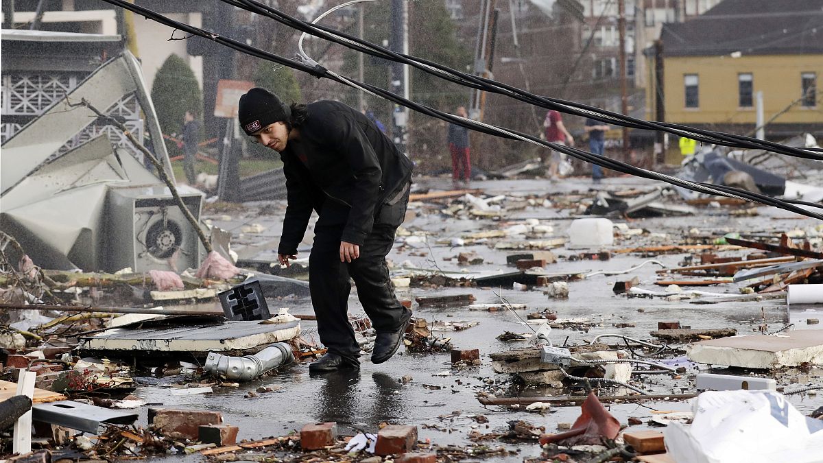 A man walks through storm debris following a deadly tornado in Nashville, Tennessee, USA. 