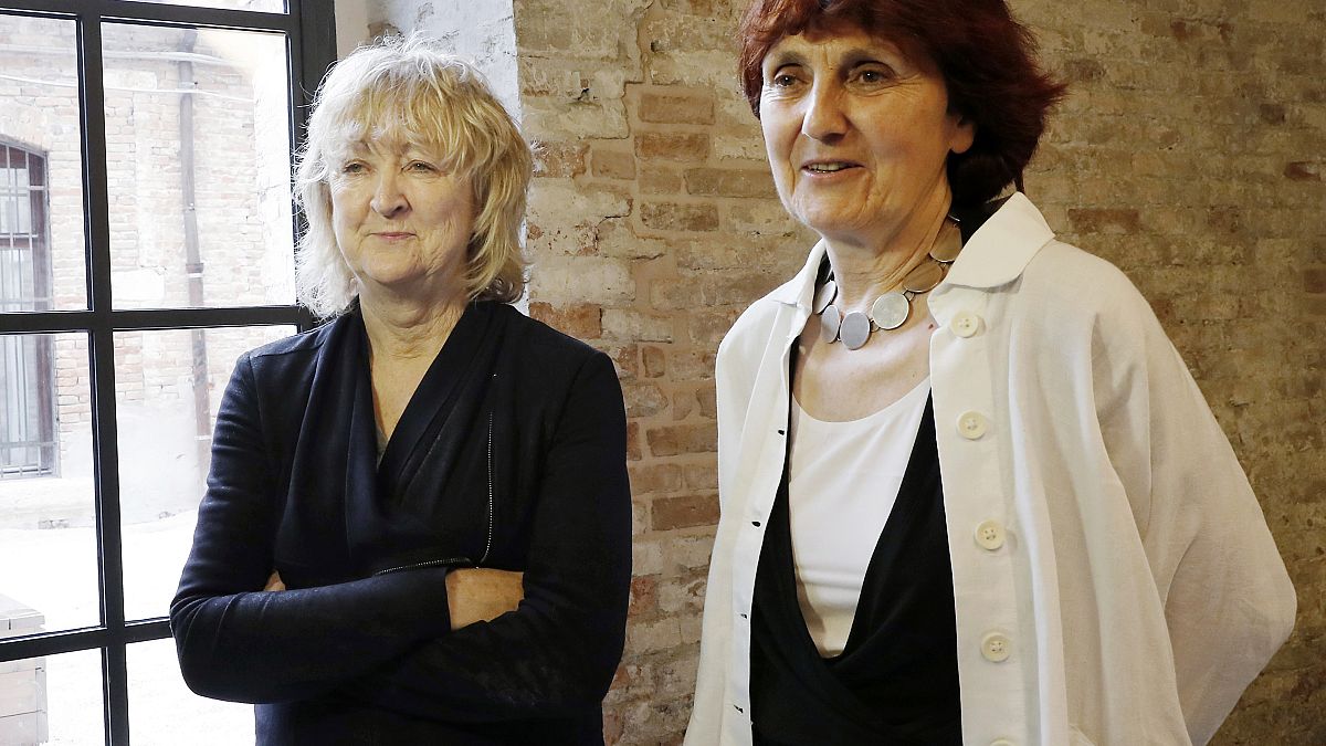 In this May 23, 2018 file photo, Biennale International Architecture exhibition curators Yvonne Farrell, left, and Shelley McNamara appear in Venice, Italy. 