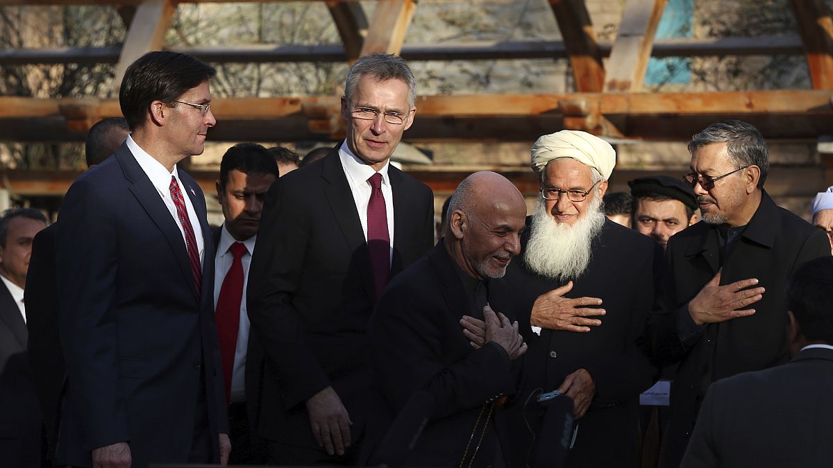 Afghan President Ashraf Ghani, center, arrives with NATO Secretary General Jens Stoltenberg, and U.S. Secretary of Defense Mark Esper for a joint news conference, Feb 29, 2020