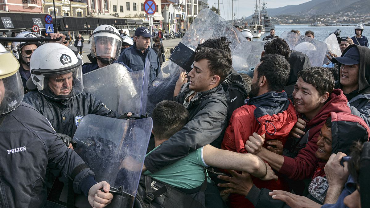 Migrants scuffle with Greek police at the port of Mytilene after locals block access to the Moria refugee camp, on the northeastern Aegean island of Lesbos, Greece.