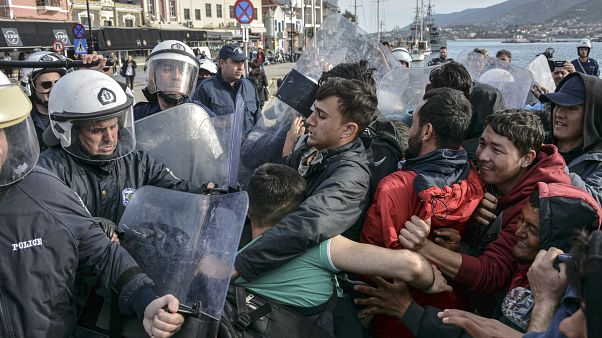 Migrants scuffle with Greek police at the port of Mytilene after locals block access to the Moria refugee camp, on the northeastern Aegean island of Lesbos, Greece.