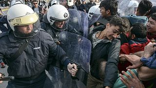 Migrants scuffle with Greek police at the port of Mytilene after locals block access to the Moria refugee camp, on the northeastern Aegean island of Lesbos, Greece