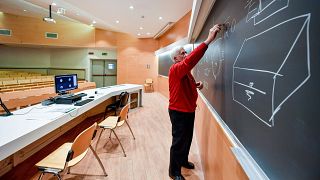 A teacher gives on-line lessons via webcam after the closure of all schools and universities in Italy due to the coronavirus outbreak