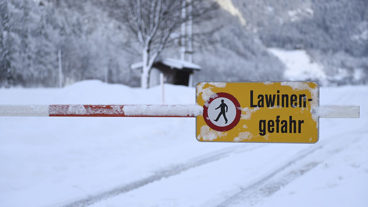 A sign saying "danger of avalanches" in Weissbach near Lofer, Austrian province of Salzburg, Jan. 11, 2019.(AP Photo/Kerstin Joensson)