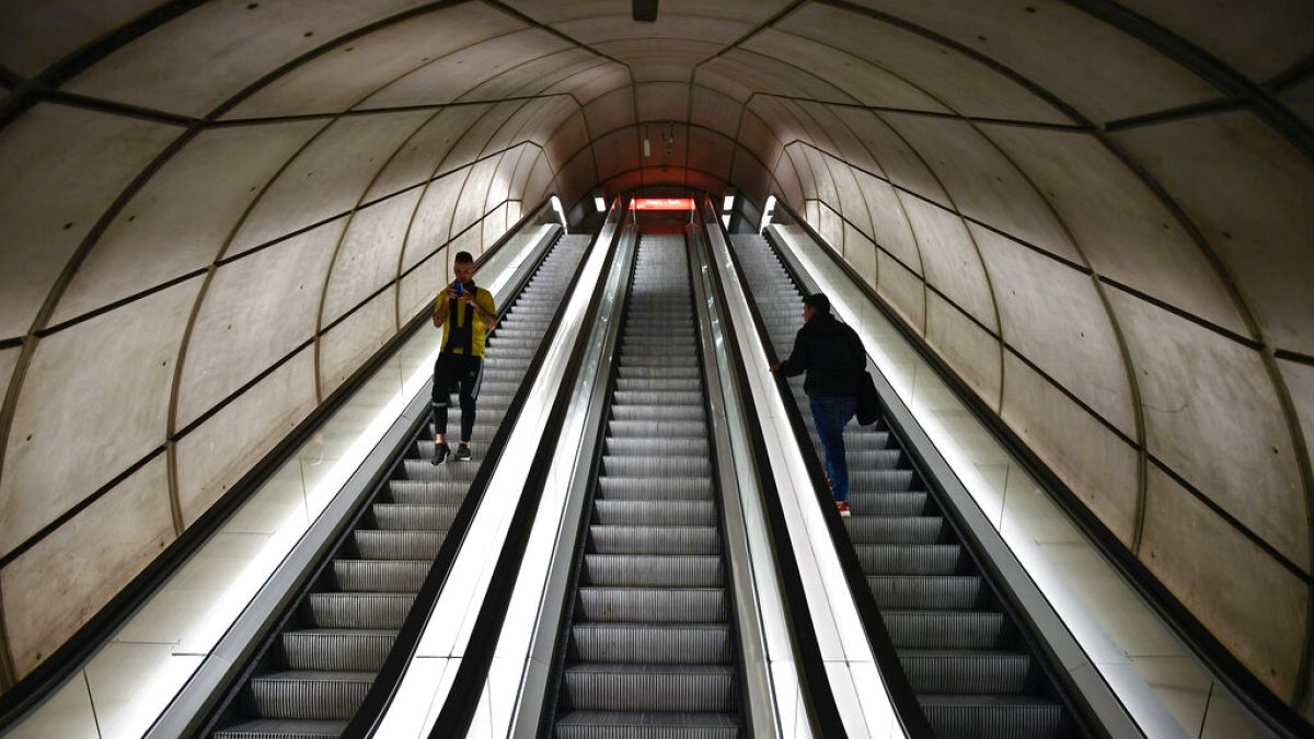 Passengers use the escalators of an empty subway station, in Bilbao, northern Spain,