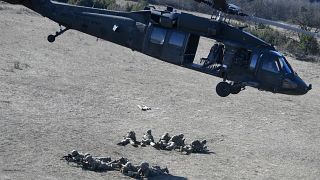 Soldiers of an American unit are dropped by a UH-60 Black Hawk helicopter at a military training center nearby Ujdoeroegd, Hungary, on March 5, 2020.