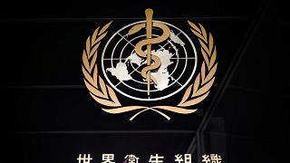 A picture taken on March 9, 2020 shows the sign of the World Health Organization