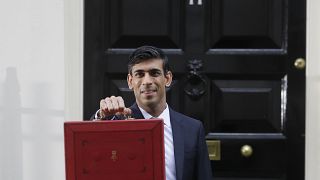 Britain's Chancellor of the Exchequer Rishi Sunak outside No 11 Downing Street with the traditional red box containing the budget speech, March 11, 2020.