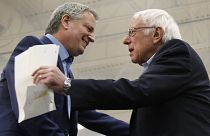New York Mayor Bill de Blasio greets Democratic presidential candidate Sen. Bernie Sanders, after introducing him at a campaign event in Carson City, Nev.