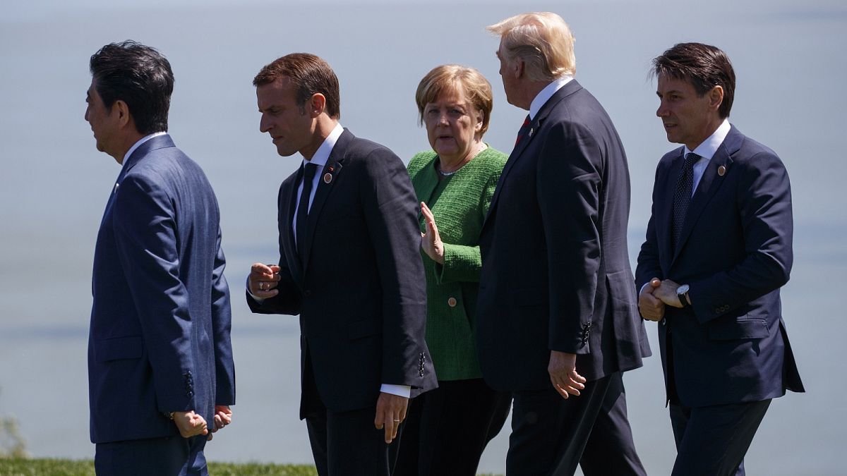 From left, Japanese Prime Minister Shinzo Abe, French President Emmanuel Macron, Merkel, Trump, and Italian Prime Minister Giuseppe Conte
