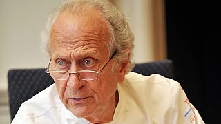 French chef Michel Roux speaks to other judges during the finals of the 'Roux Scholarship' competition at the Mandarin Oriental hotel in central London, on April 6, 2009. 