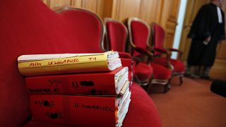 The judiciary files of retired French surgeon Joel Le Scouarnec are displayed on the opening day of his trial in the courthouse of Saintes