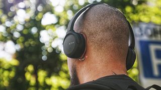 Man listening to music through headphones