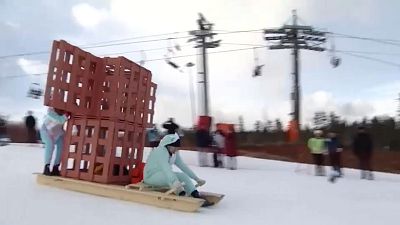 Russians amuse in creative home-made sledge riding