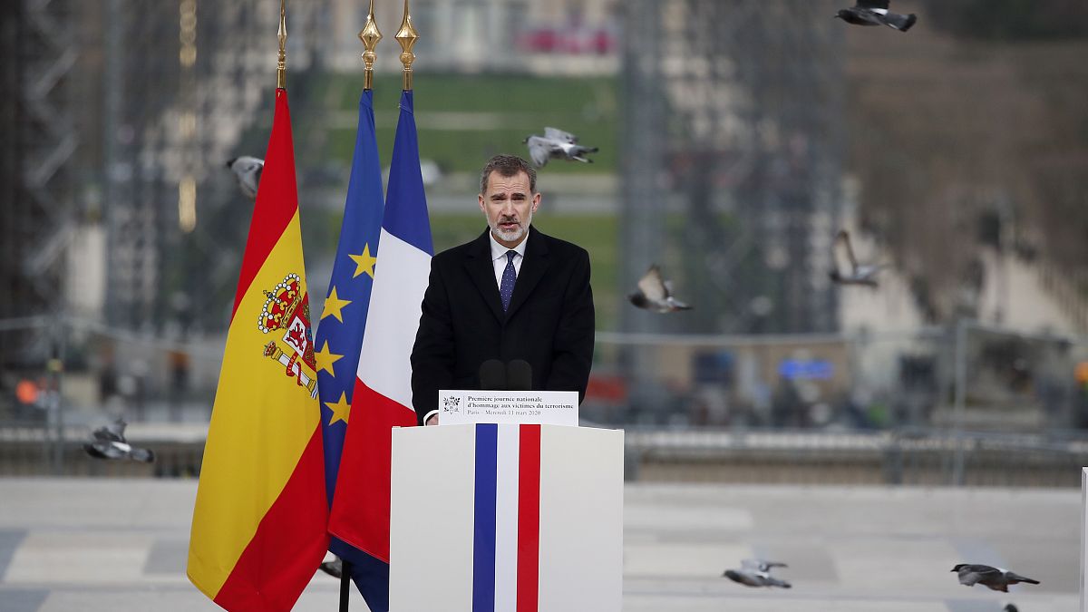 Spain's King Felipe VI delivers his speech during a ceremony to honor victims of terror attacks in Europe, on the 16th anniversary of Madrid attacks, at the Trocadero in Paris