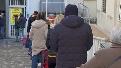 Coronavirus: Italians comply with social distancing rules outside supermarket