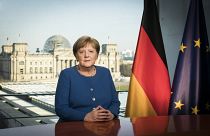 German Chancellor Angela Merkel poses for a photo during the recording of her first direct TV address to the nation in over 14 years in power, at the chancellery in Berlin.