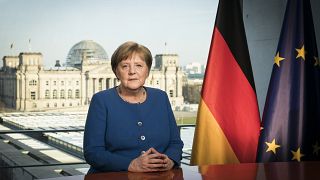 German Chancellor Angela Merkel poses for a photo during the recording of her first direct TV address to the nation in over 14 years in power, at the chancellery in Berlin.