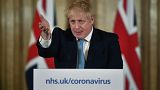 Britain's Prime Minister Boris Johnson gestures, during a coronavirus news conference at 10 Downing Street, in London, Thursday, March 19, 2020.