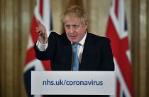Britain's Prime Minister Boris Johnson gestures, during a coronavirus news conference at 10 Downing Street, in London, Thursday, March 19, 2020.
