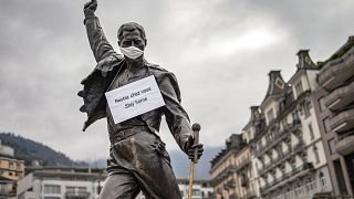 The statue of Freddie Mercury wearing a protective facemask, adorned with a message raising awareness against the spread of the COVID-19, Switzerland