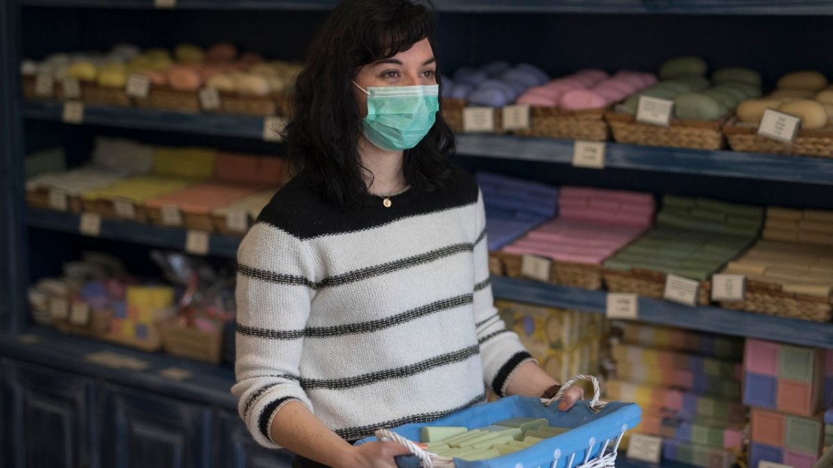 Melanie Dinot, a retail worker at the Savonnerie de la Licorne poses for a portrait hours before nationwide confinement measures were in effect in Marseille, France, March 17.