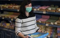 Melanie Dinot, a retail worker at the Savonnerie de la Licorne poses for a portrait hours before nationwide confinement measures were in effect in Marseille, France, March 17.