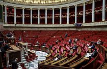 French members of Parliament take part in a debate about the state of health emergency bill at the National Assembly on March 21, 2020, in Paris