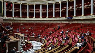 French members of Parliament take part in a debate about the state of health emergency bill at the National Assembly on March 21, 2020, in Paris