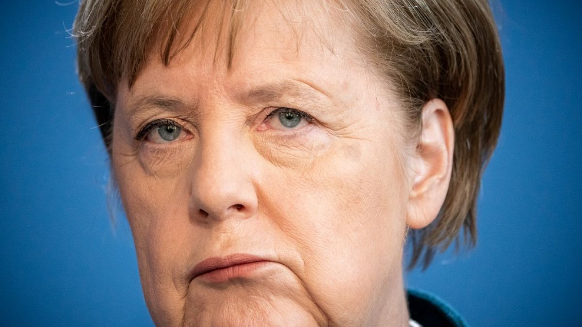 German Chancellor Angela Merkel makes a press statement. (Photo by Michael Kappeler / POOL / AFP)
