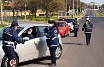 Members of the Rome Local Police check the documents and the self-declarations of motorists on the Via Pontina, in Rome, on March 21, 2020