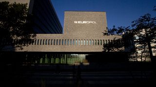 This Wednesday, Oct. 10, 2018, file photo shows the sun bouncing off the Europol headquarters in The Hague, Netherlands.