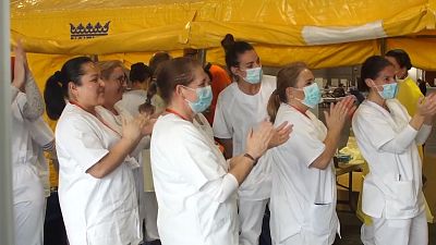 Field hospital in Madrid celebrates their first coronavirus patient being given the all-clear