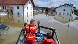 Members of the German Life-Saving Association patrol onboard a boat through the flooded streets in Deggendorf, Bavaria, 5 June 2013