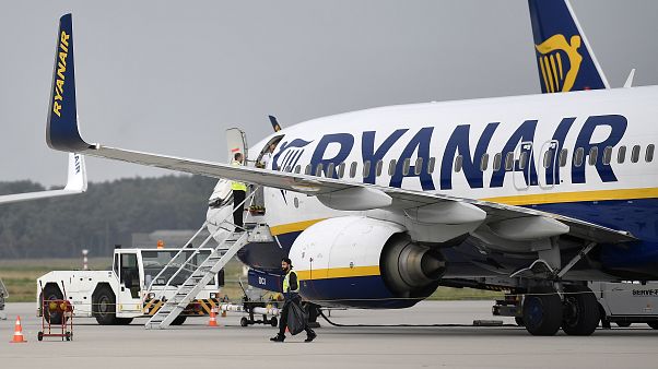 In this Sept. 12, 2018 file photo, a Ryanair plane parks at the airport in Weeze, Germany. In this Sept. 12, 2018 file photo, a Ryanair plane parks at the airport in Weeze, Germany.