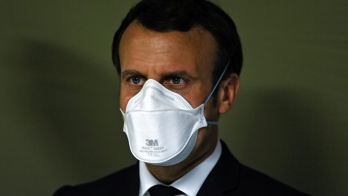 French President Emmanuel Macron wears a face mask during the visit of the military field hospital in Mulhouse, eastern France, on March 25, 2020