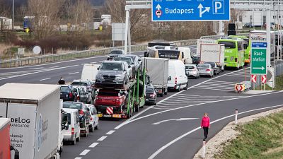 Drivers wait in the traffic jams on the A4 motorway towards Hungary. (Photo by ALEX HALADA / AFP)