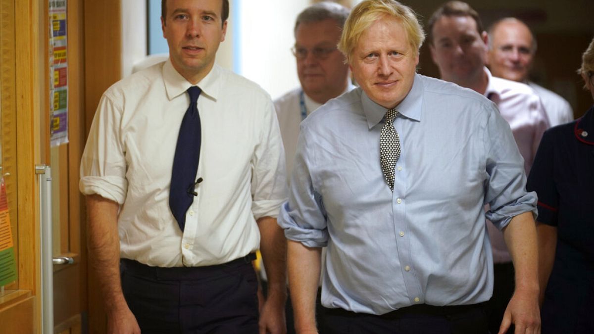 UK health minister Matt Hancock (left) with Prime Minister Boris Johnson